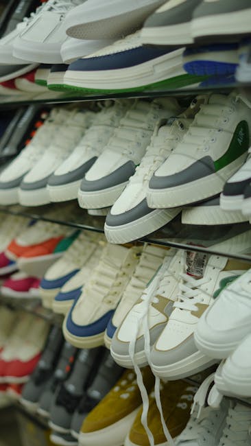 Wide variety of sneakers displayed in a Dubai store, showcasing different styles and colors.